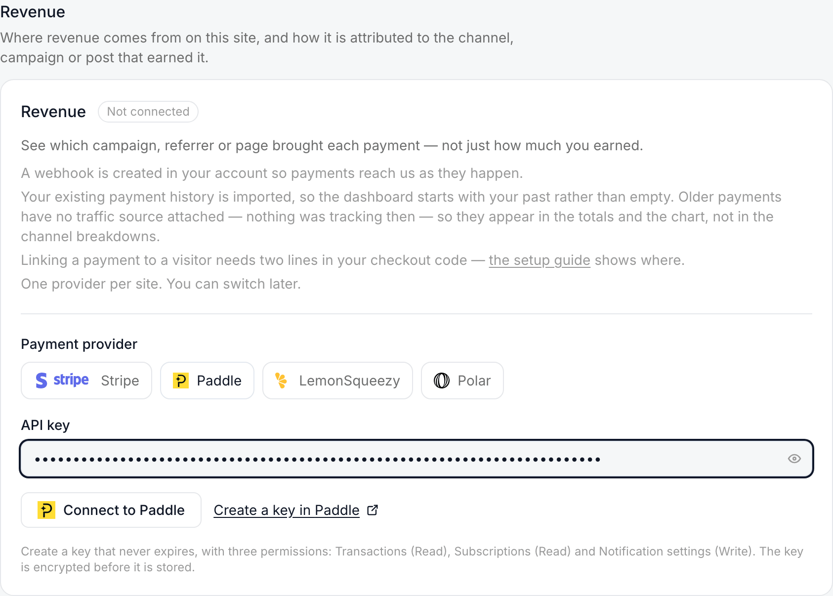 The Revenue card with Paddle chosen and a key in the API key field; the note under Connect lists the three permissions: Transactions (Read), Subscriptions (Read), Notification settings (Write)